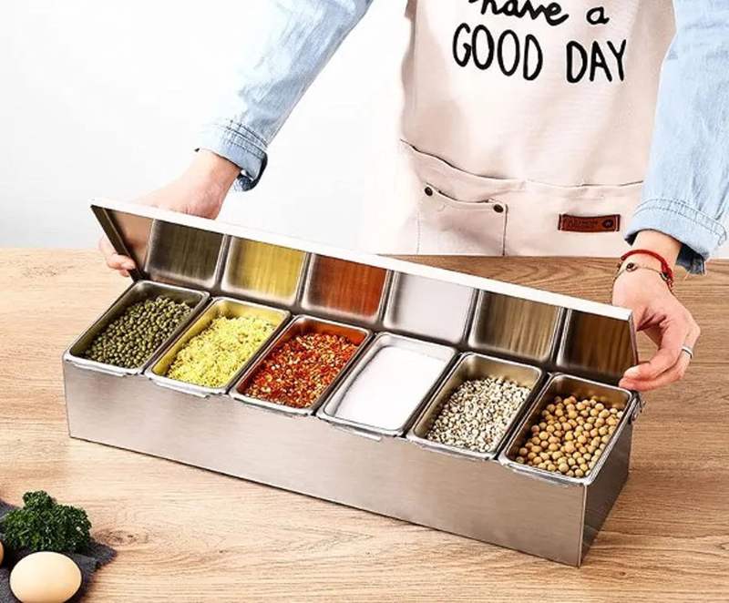 condiment bar caddy filled with pizza toppings and garnishes
