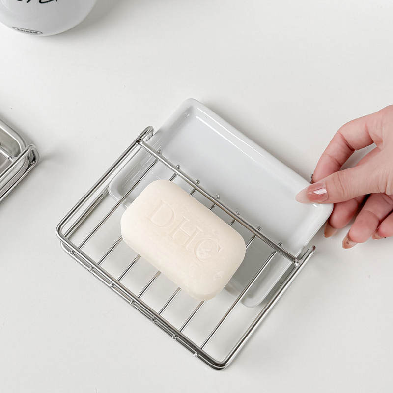 Easily cleanable stainless steel soap holder with soap saver pad
