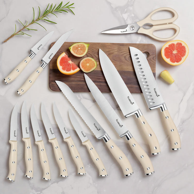 stainless steel kitchen knife set with light handles laid out