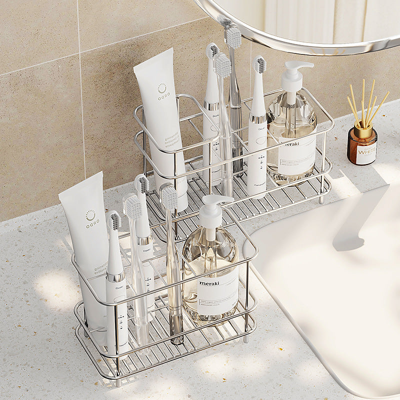 Multi-functional bathroom storage rack holding toothbrush, toothpaste, and cups