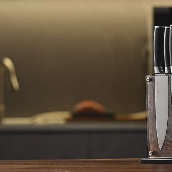 stainless steel knife block set with transparent holder on kitchen counter