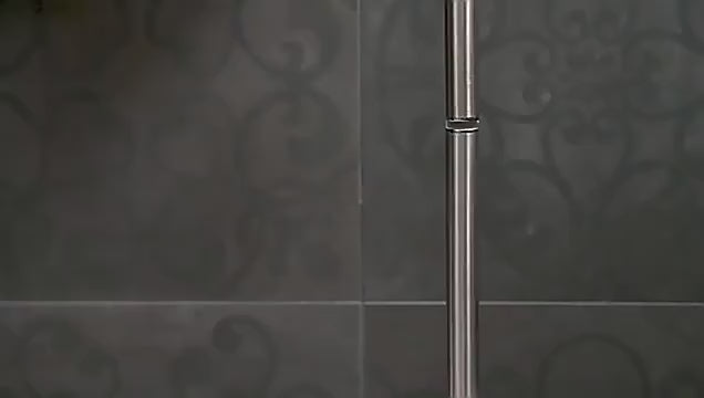 modern stainless steel toilet paper holder in bathroom
