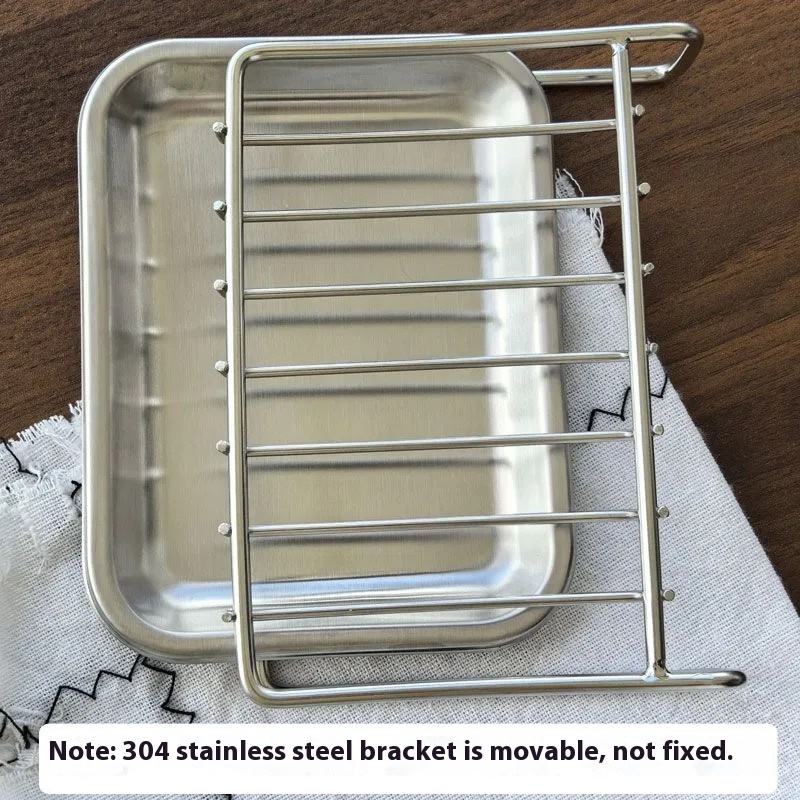 Sleek stainless steel soap holder on bathroom countertop with bar soap