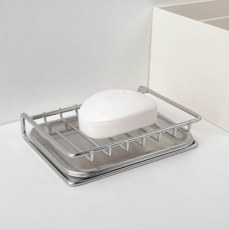 Soap holder with slotted design draining excess water into the sink