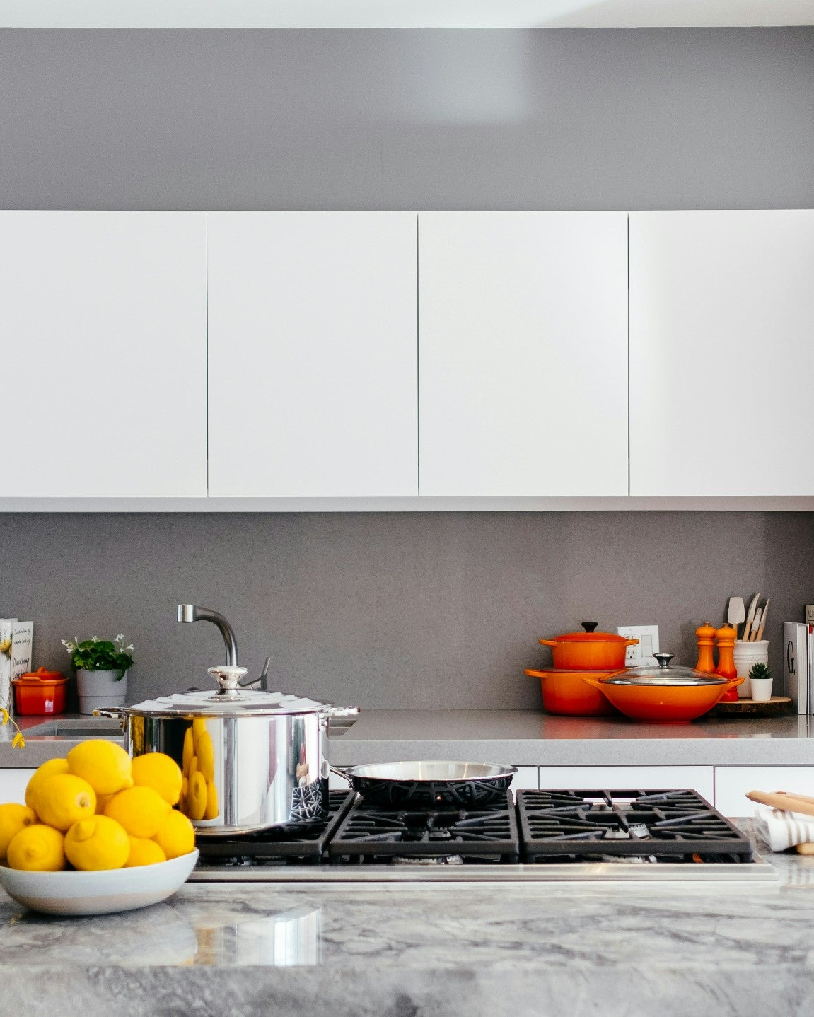 Stainless steel cookware displayed in a modern kitchen, highlighting durable and versatile kitchen and bar essentials.